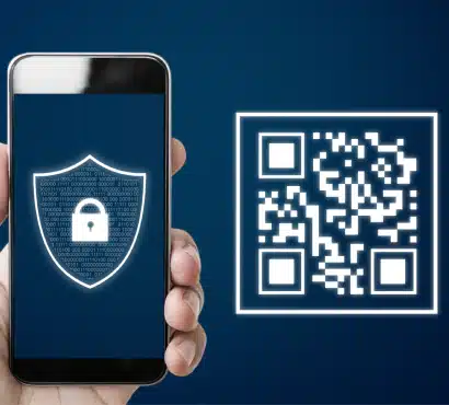 A hand holding a smartphone with a digital shield and padlock icon on the screen, next to a glowing QR code on a dark blue background, symbolizing digital security and secure transactions.